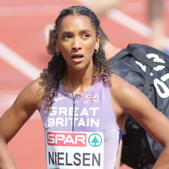 Lina Nielsen on the track wearing a lilac Great Britain vest